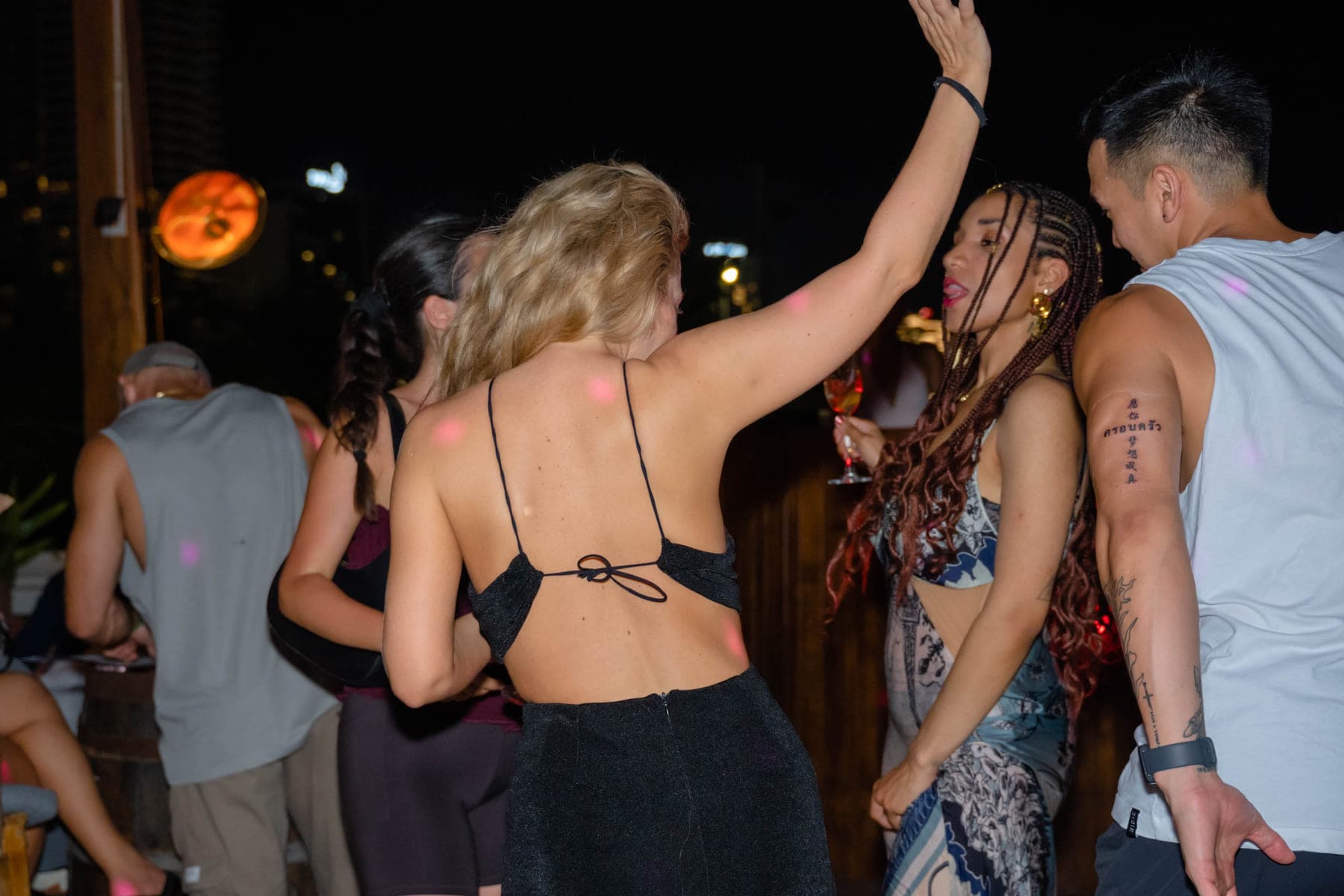 Guests dancing under the lanterns at The Roof, Da Nang